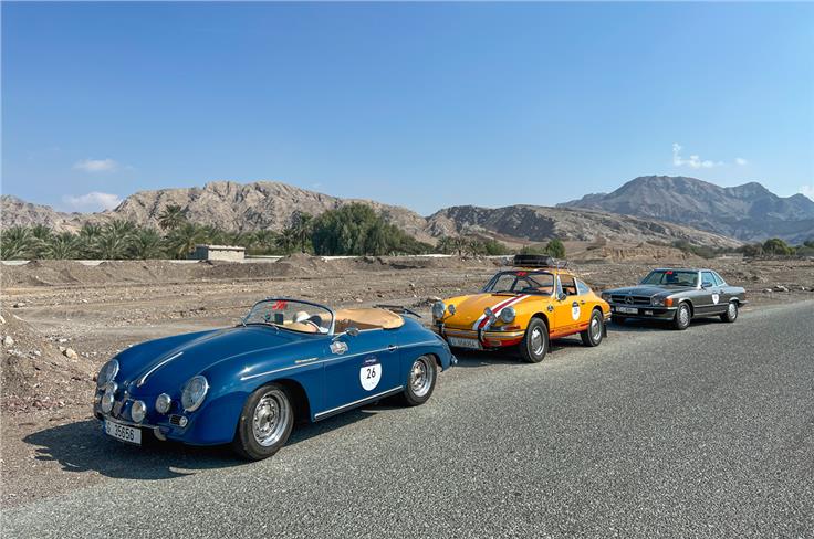 Porsche Speedster, Bahama Mama (Jacky Ickx&#8217;s Porsche 911), Perseus Bandrawalla and Chinmay Bafna's R107 SL in the desert in route to Ras Al Khaimah. 